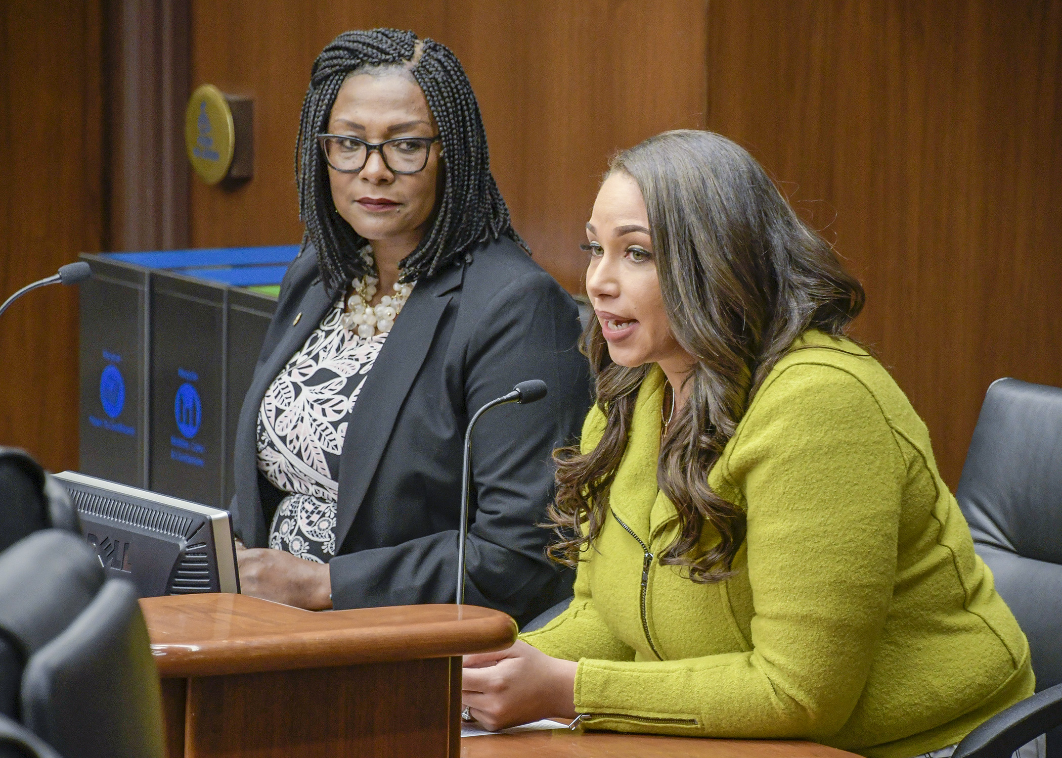 Georgia Fort testifies before the House Jobs and Economic Development Finance Division Feb. 18 in support of a bill sponsored by Rep. Rena Moran, left, that would modify pregnancy and parenting leave incumbency requirements. Photo by Andrew VonBank